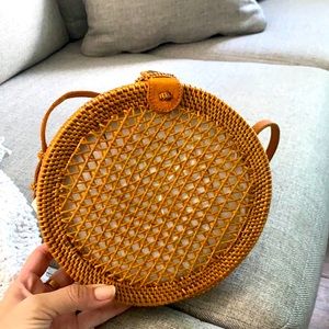 Woven rattan canteen bag by straw studios